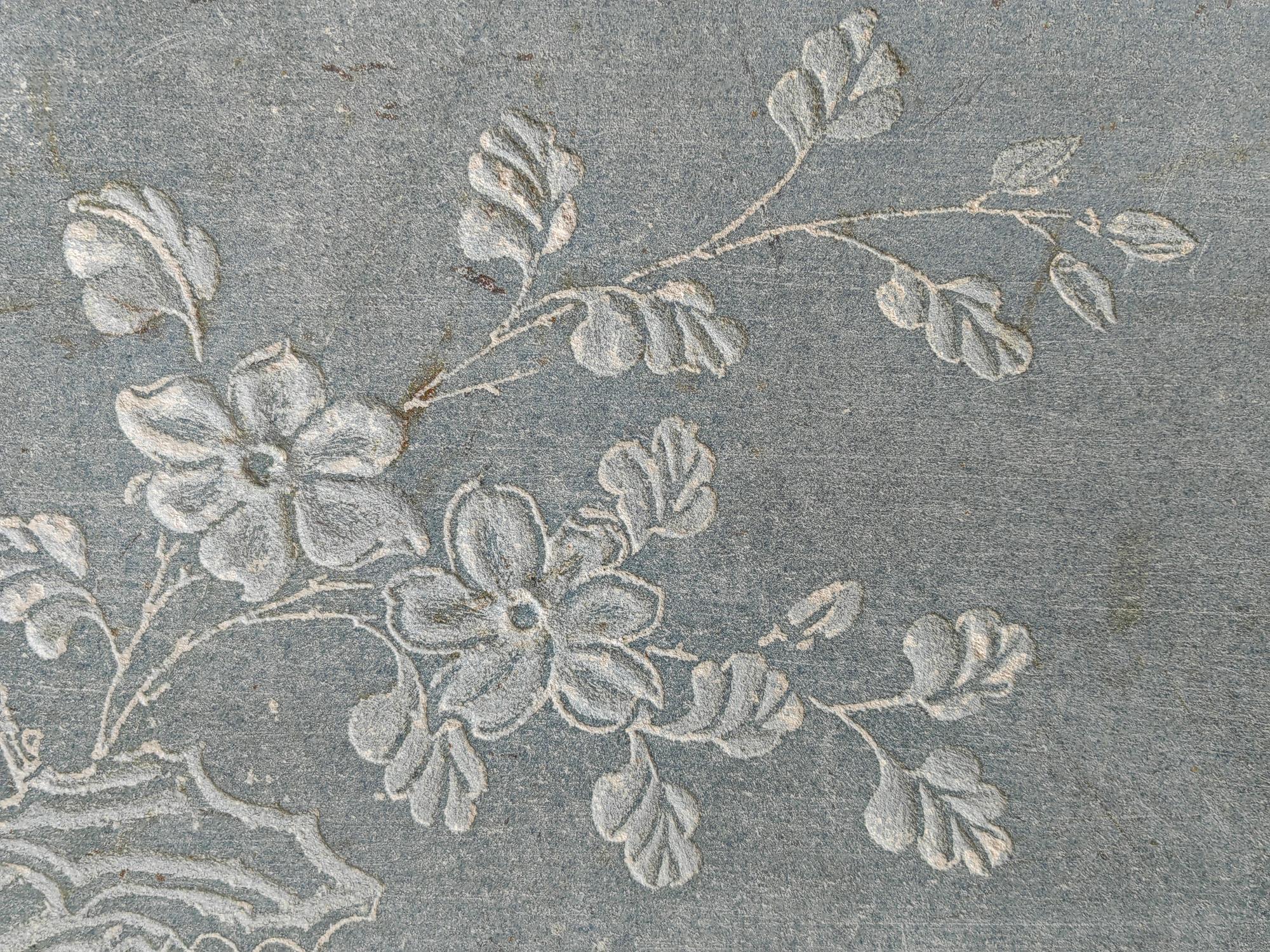 close-up of stitched floral pattern on linen
