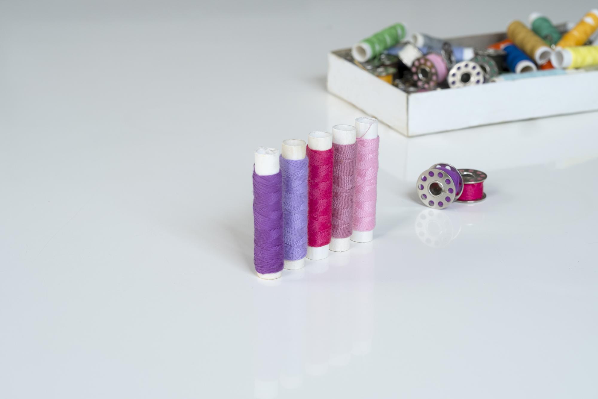 three embroidery kits on a studio table